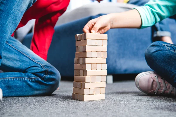 Children playing with wooden blocks — Stock Photo