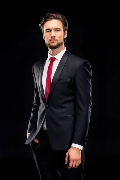 Handsome businessman in black suit — Stock Photo