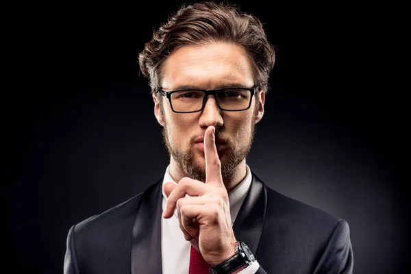 Businessman gesturing for silence — Stock Photo