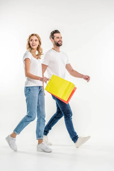 Couple walking with shopping bags — Stock Photo
