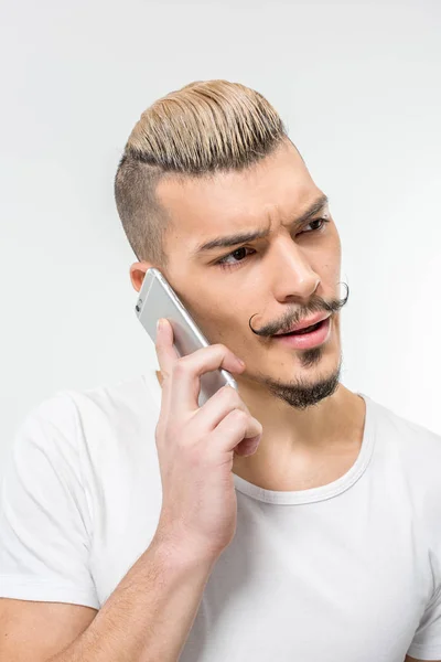 Handsome man using smartphone — Stock Photo