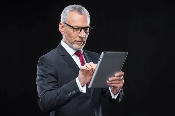 Businessman holding digital tablet — Stock Photo