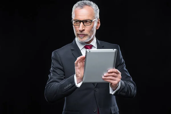 Businessman holding digital tablet — Stock Photo