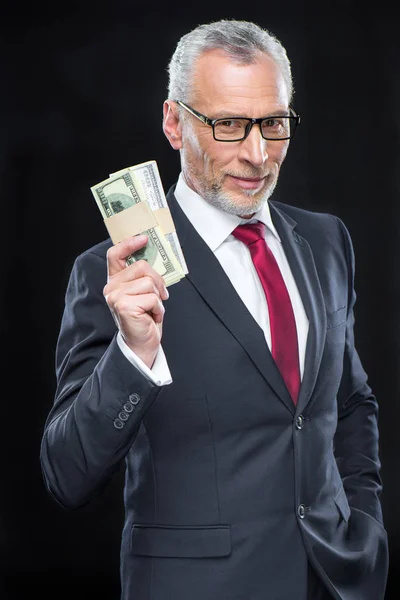 Geschäftsmann mit Dollar-Banknoten — Stockfoto