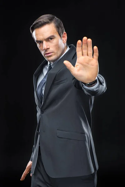 Handsome businessman gesturing — Stock Photo