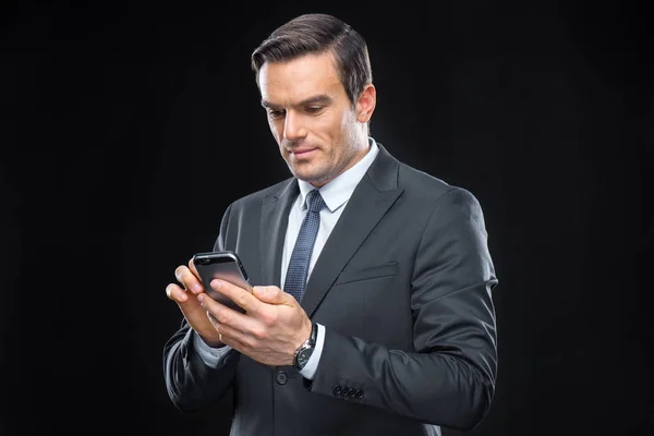 Businessman using smartphone — Stock Photo