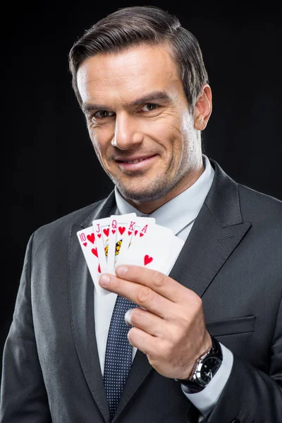 Man holding playing cards — Stock Photo