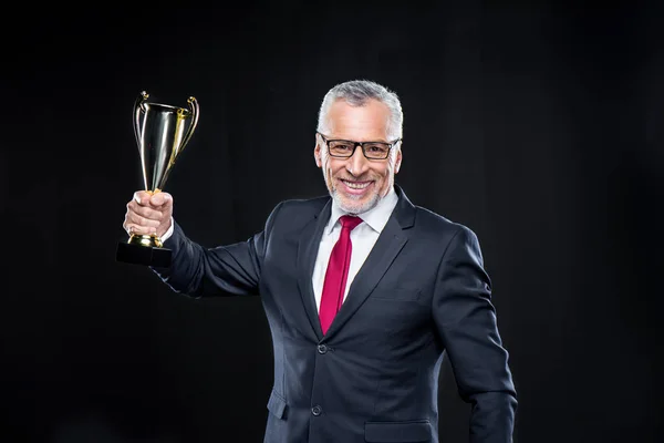Businessman with award cup — Stock Photo
