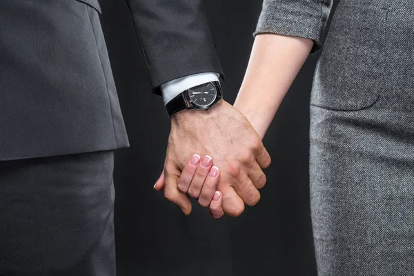 Man and woman holding hands — Stock Photo