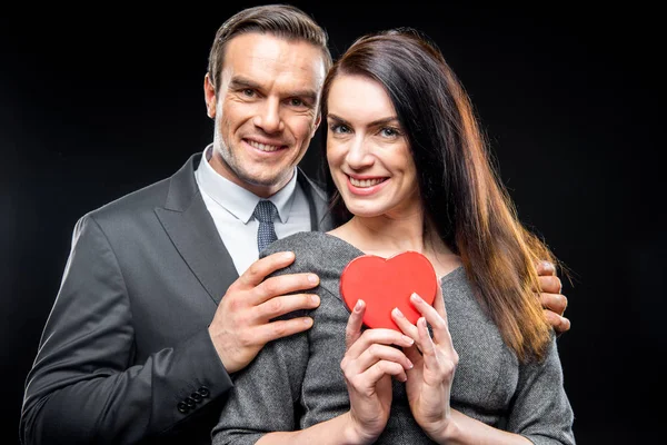 Couple holding toy heart — Stock Photo