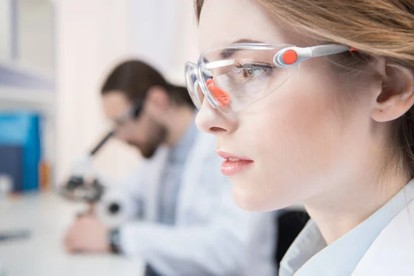 Attractive female scientist — Stock Photo