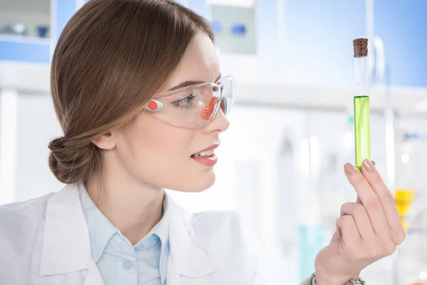 Scientist holding test tube — Stock Photo