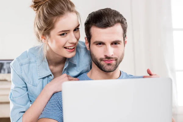 Couple using laptop — Stock Photo