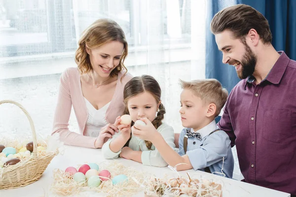 Family with easter eggs — Stock Photo