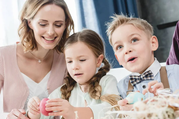 Family with easter eggs — Stock Photo
