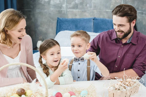 Family with easter eggs — Stock Photo