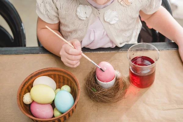 Girl paiting Easter eggs — Stock Photo