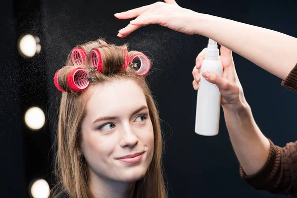 Young woman in curlers — Stock Photo