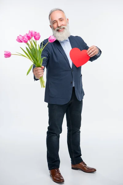 Seniorchef mit Tulpen — Stockfoto