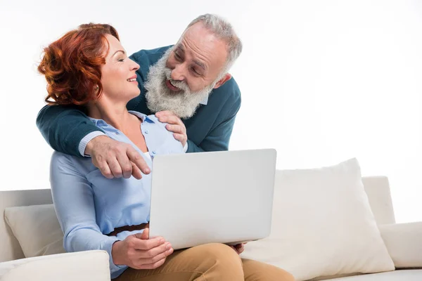 Mature couple using laptop — Stock Photo