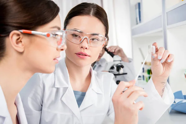 Young female scientists — Stock Photo