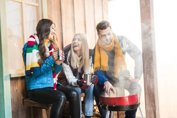 Happy friends on porch — Stock Photo