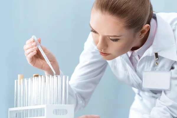 Scientist working with test tubes — Stock Photo