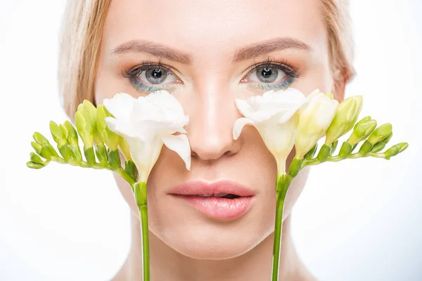 Young woman with flowers — Stock Photo