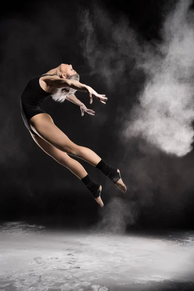 Dancing woman in bodysuit — Stock Photo