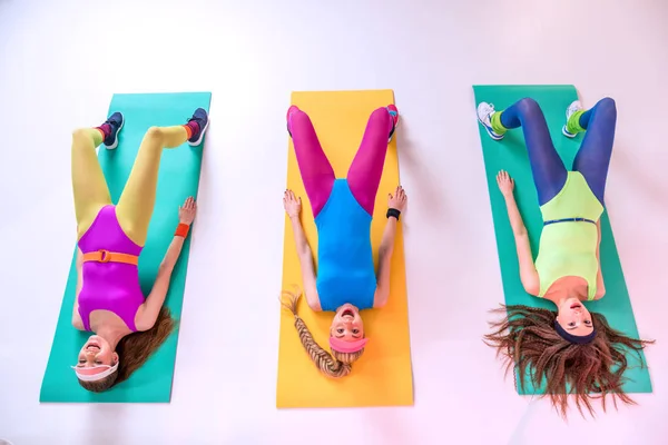 Sporty women doing exercises — Stock Photo