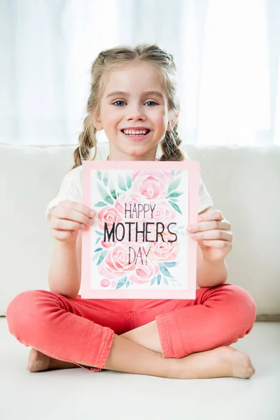 Girl holding postcard — Stock Photo