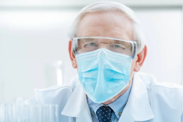 Senior chemist in goggles — Stock Photo