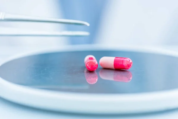 Pills on lab scales — Stock Photo