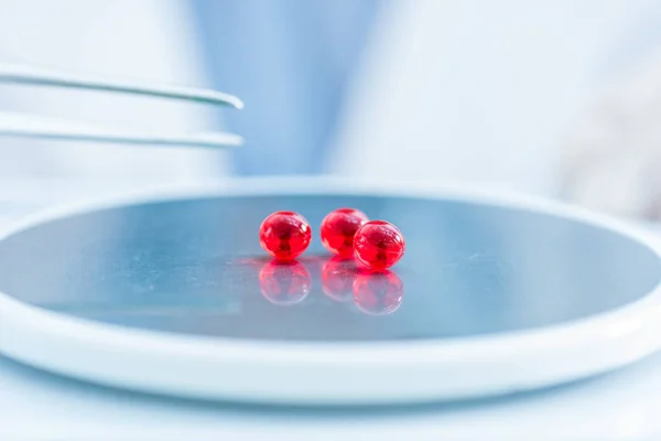 Pills on lab scales — Stock Photo