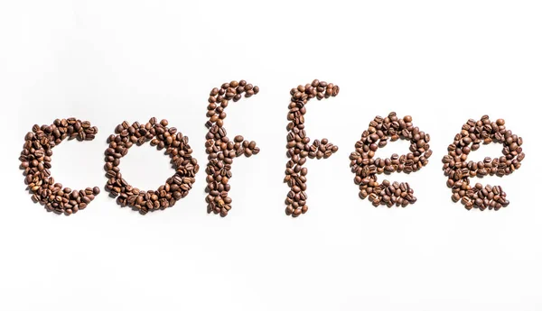 Слово кофе из кофейных зерен — стоковое фото