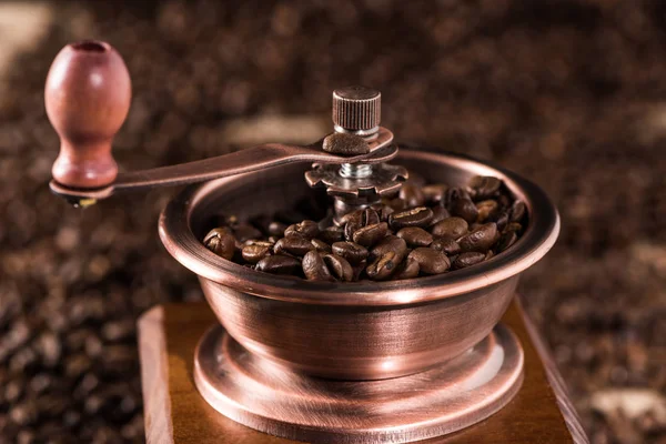 Coffee mill with coffee beans — Stock Photo