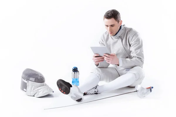 Fencer using digital tablet — Stock Photo