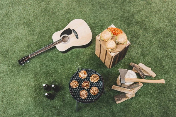 Grill with meat and guitar — Stock Photo