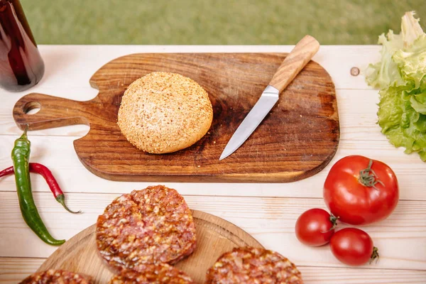 Ingredients for hamburgers on table — Stock Photo