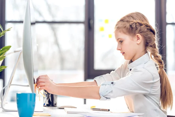 Little girl pretending to be businesswoman — Stock Photo