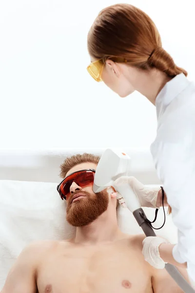 Man receiving laser skin care — Stock Photo