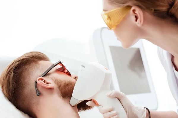 Man receiving laser skin care — Stock Photo