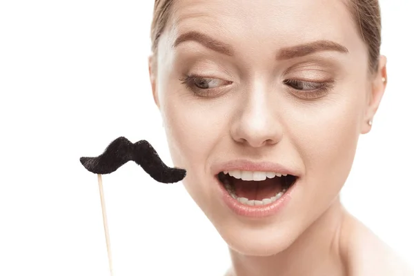 Woman with black mustaches on stick — Stock Photo