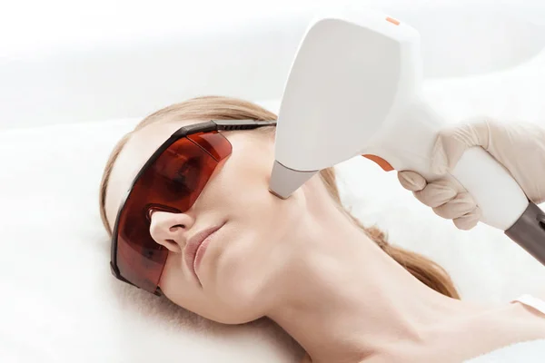 Woman receiving laser treatment — Stock Photo