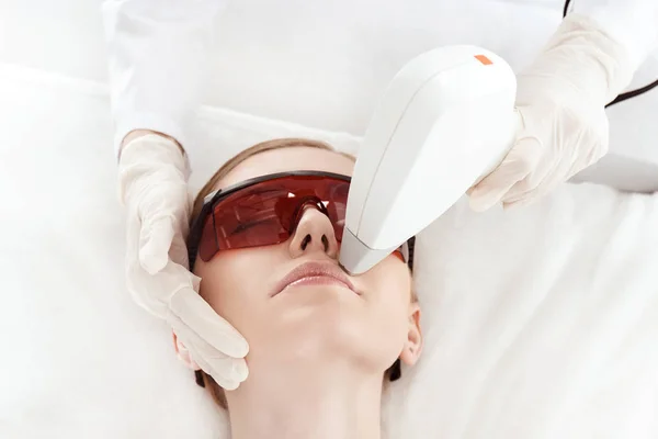 Woman receiving laser treatment — Stock Photo