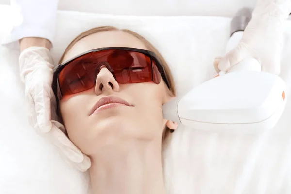 Woman receiving laser treatment — Stock Photo