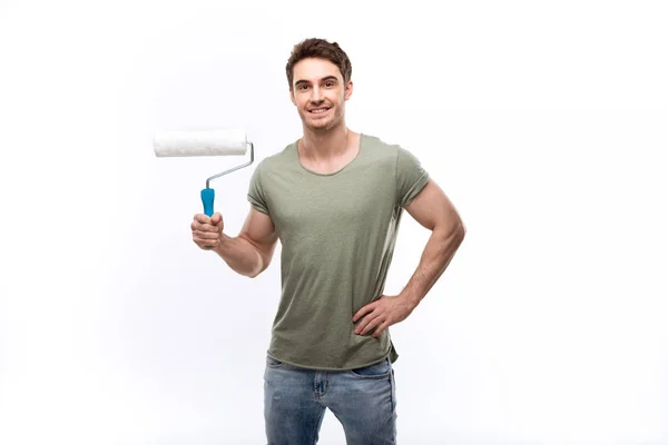 Man holding paint roller — Stock Photo