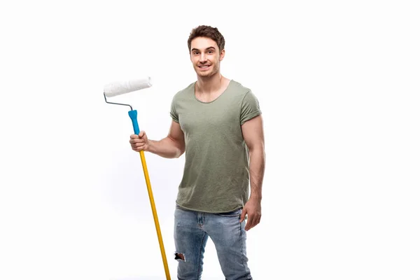 Man holding paint roller — Stock Photo