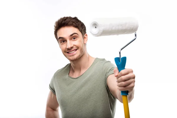 Man holding paint roller — Stock Photo