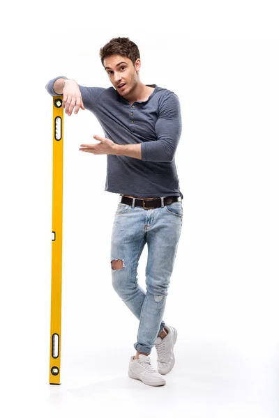 Man holding building level — Stock Photo